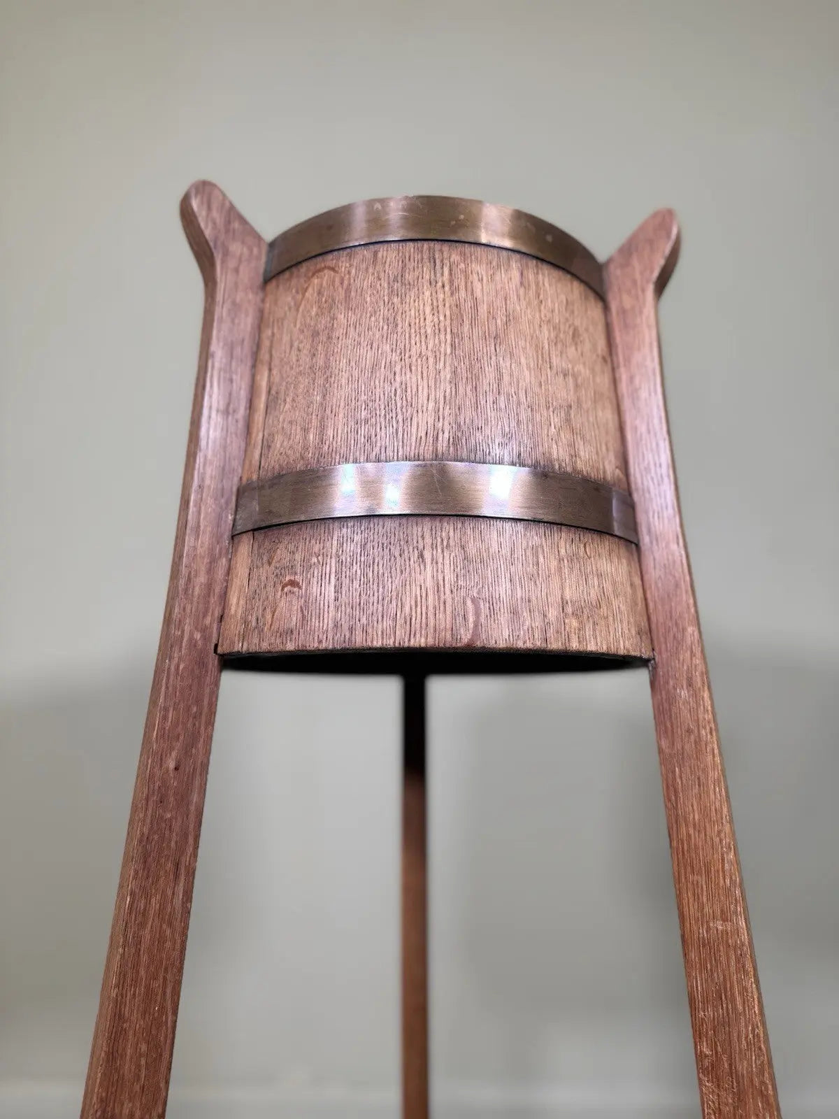 R.A. Lister antique oak jardinière plant stand coopered barrel with copper banding and splayed legs.