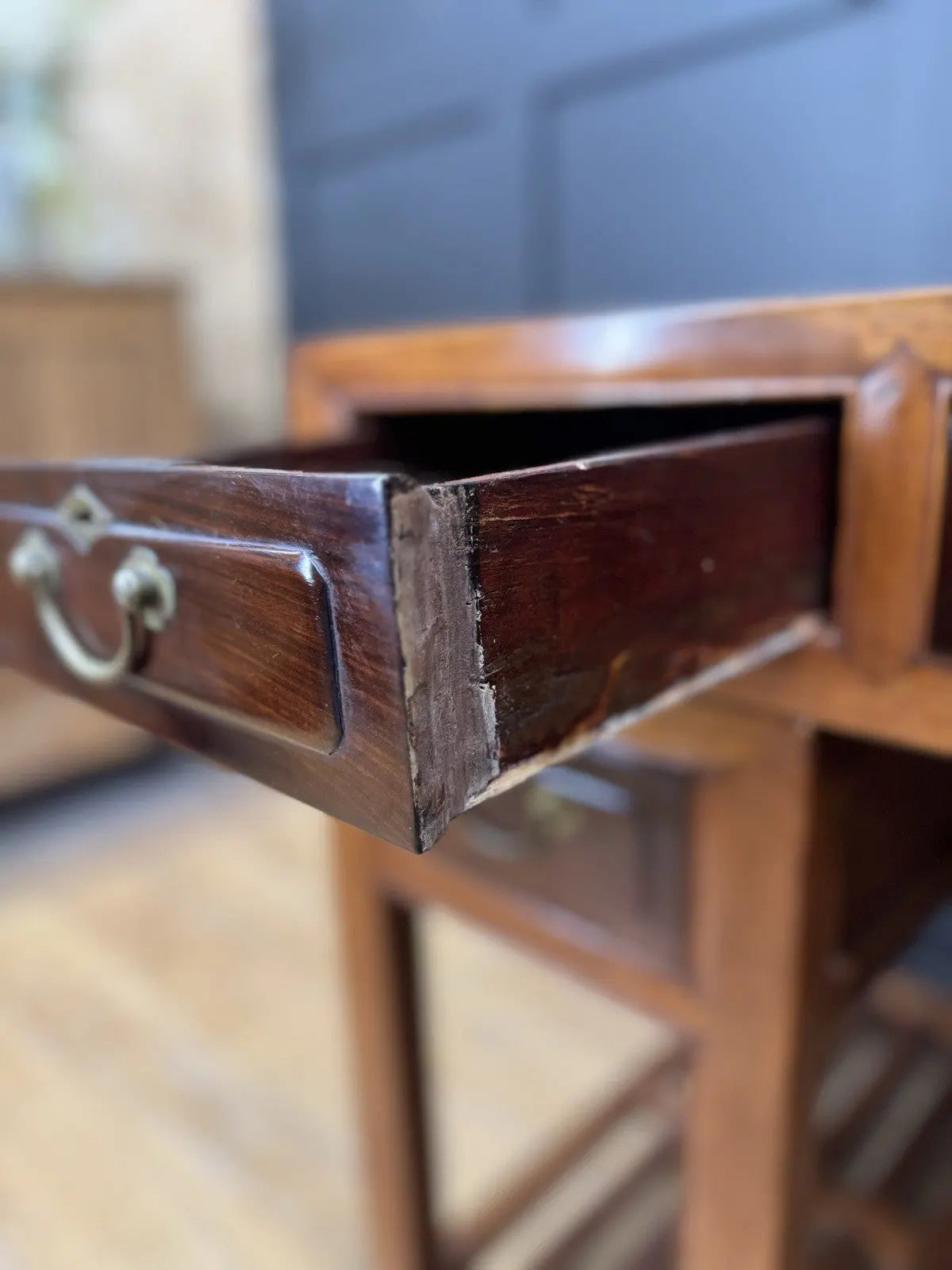 Antique Chinese hardwood writing desk, rich brown finish, elegant traditional pedestal design.