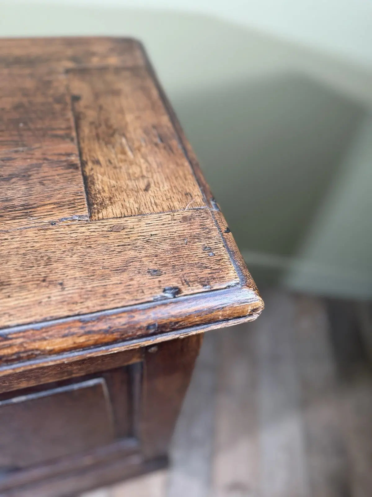 Antique oak mule chest brown four-panelled design with two drawers and rich grain.