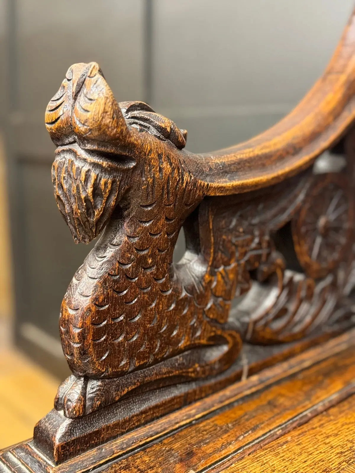 Victorian carved oak hall bench, brown, intricate Gothic Revival carvings and mythical figures.