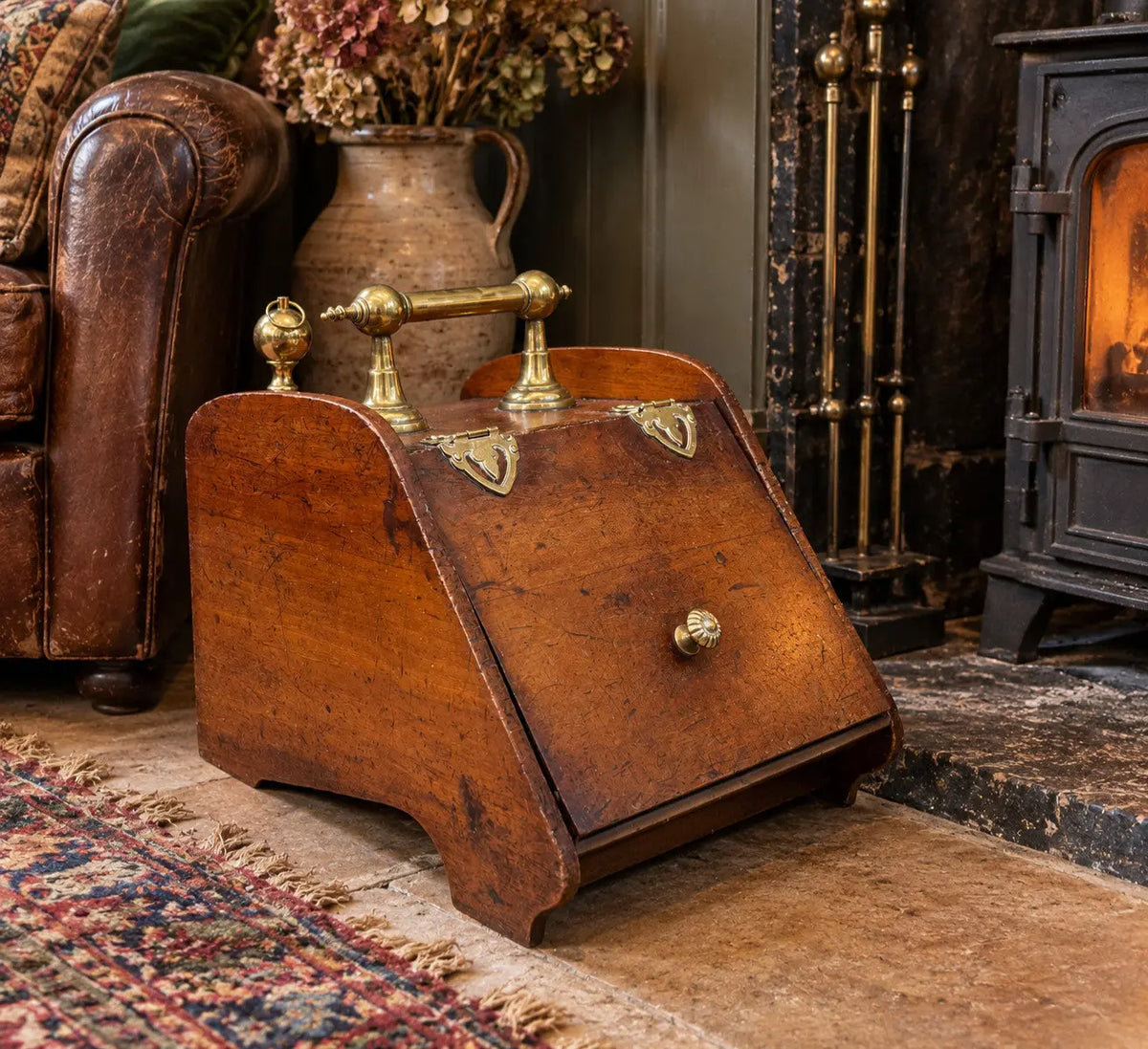 Victorian walnut coal purdonium scuttle box with brass fittings and ornate handle.