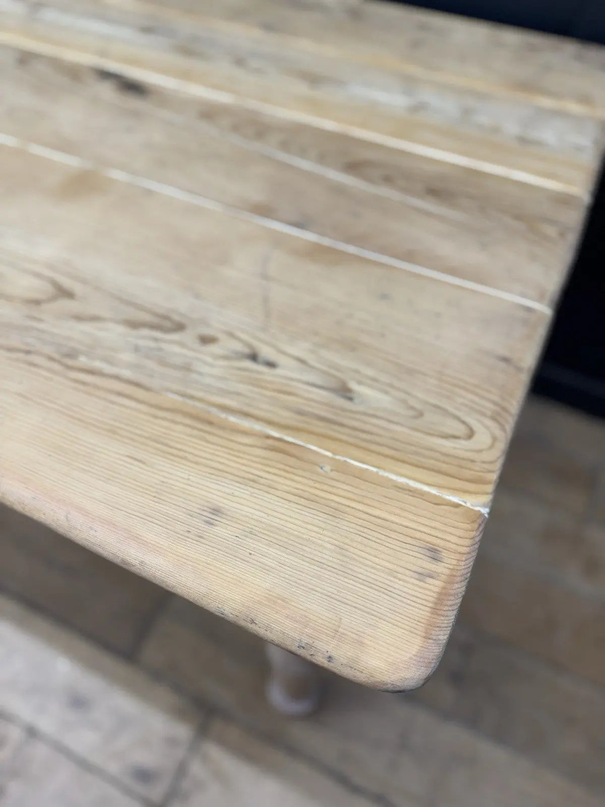 Victorian pine farmhouse dining table brown solid plank top with two drawers and ceramic knobs.