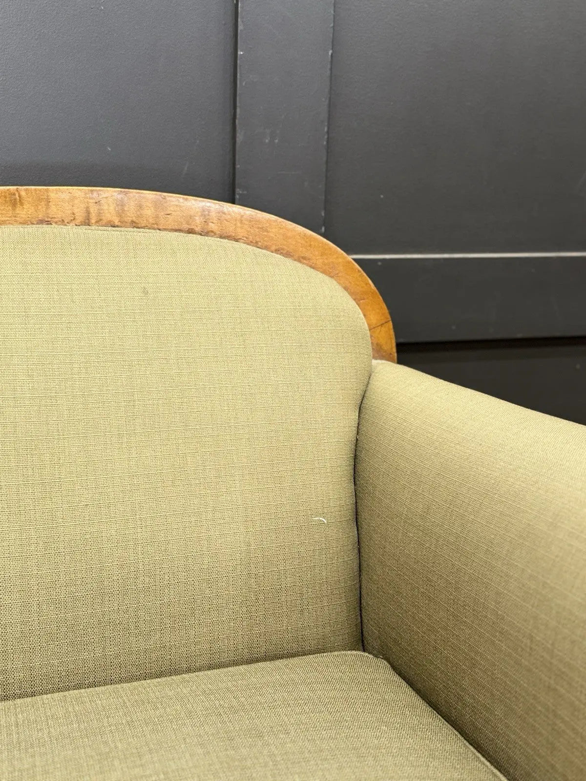 French's green Art Deco armchairs with walnut scroll arms and tapered legs.