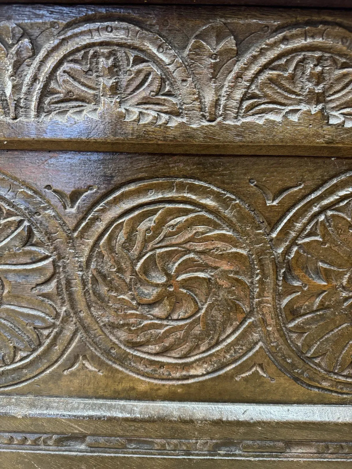 Antique oak hope chest brown with intricate floral carvings and spacious interior.