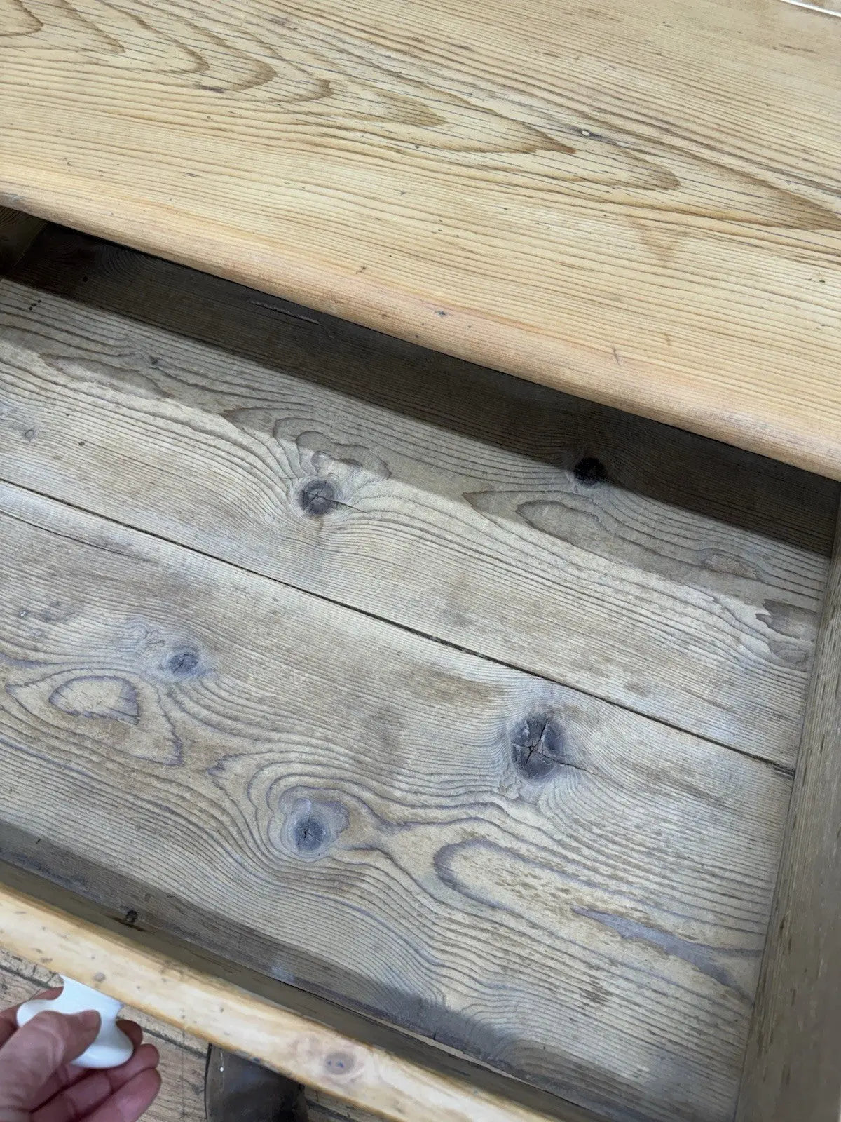 Victorian pine farmhouse dining table brown solid plank top with two drawers and ceramic knobs.
