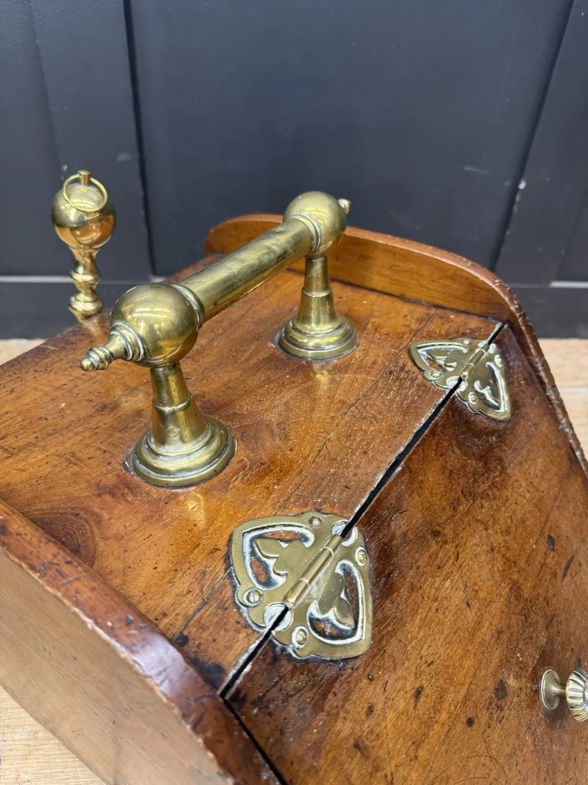 Victorian walnut coal purdonium scuttle box with brass fittings and ornate handle.