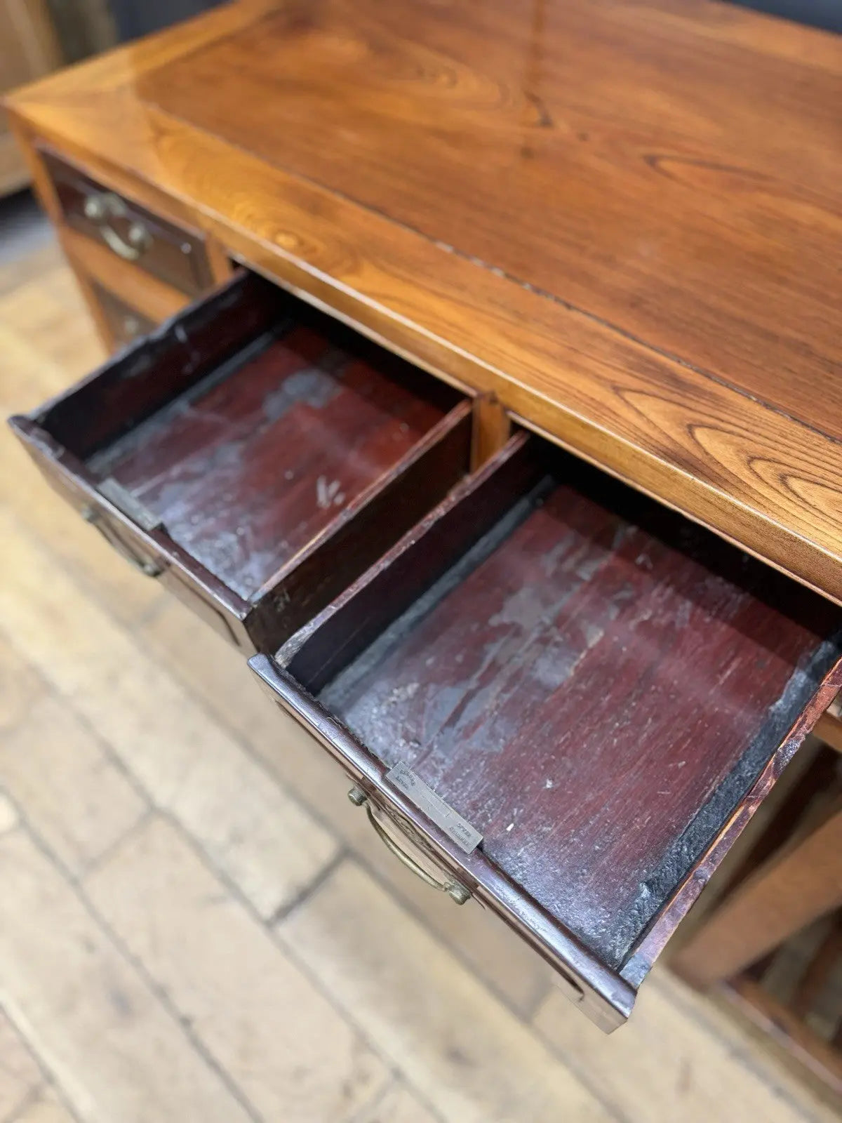 Antique Chinese hardwood writing desk, rich brown finish, elegant traditional pedestal design.