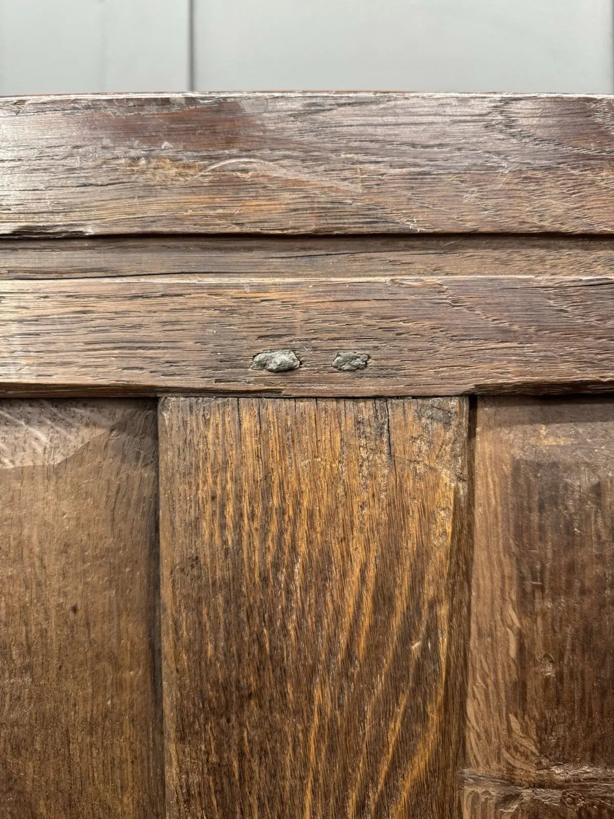 Georgian carved oak hope chest brown with floral motifs and iron hinges.