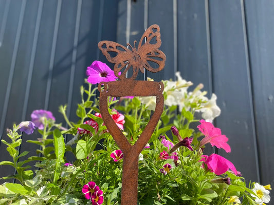 Butterfly on a spade garden decoration