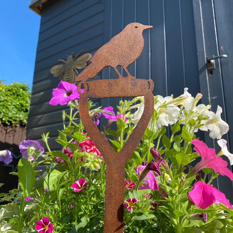 Blackbird on a spade garden decoration 