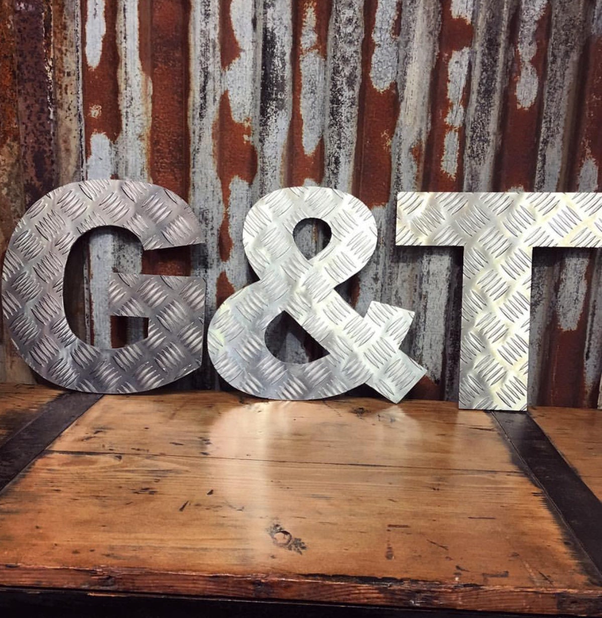 aluminium chequer plate lettering spelling out G&T