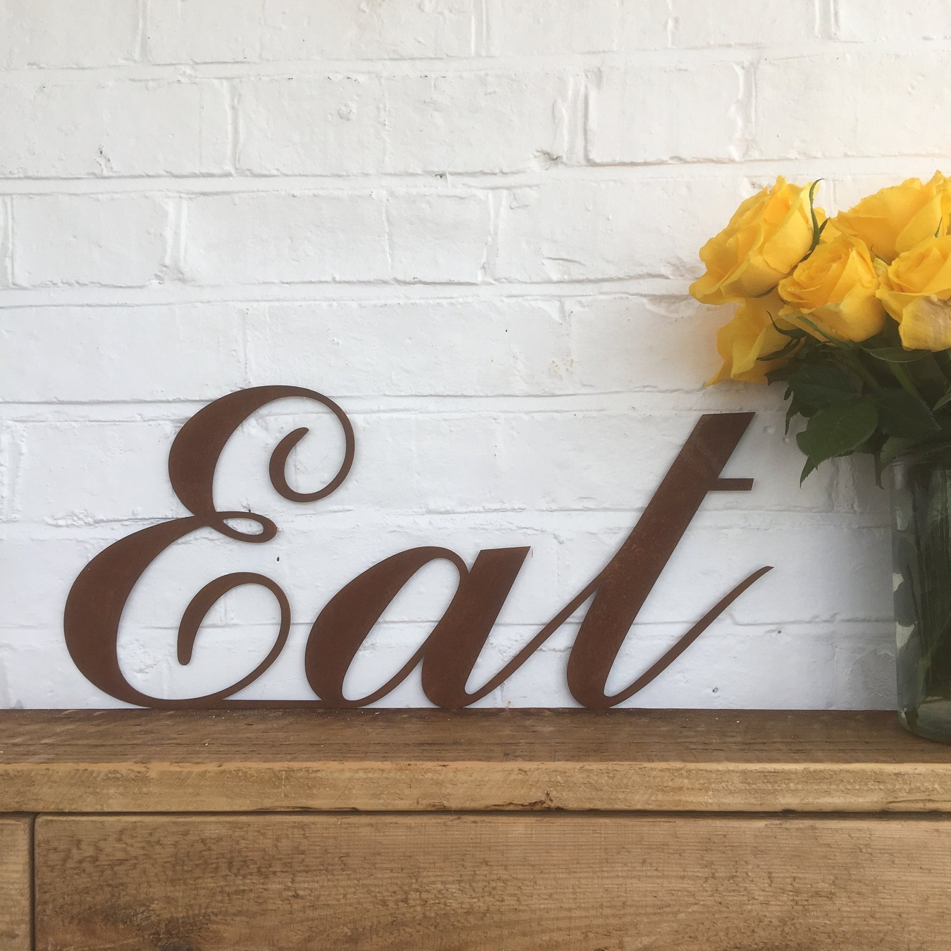 rusty metal eat sign