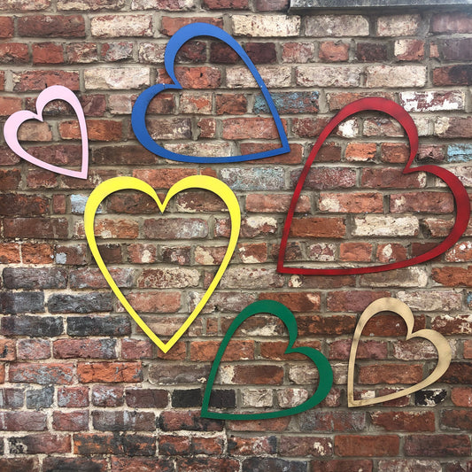 multi coloured hollow hearts wall decorations.