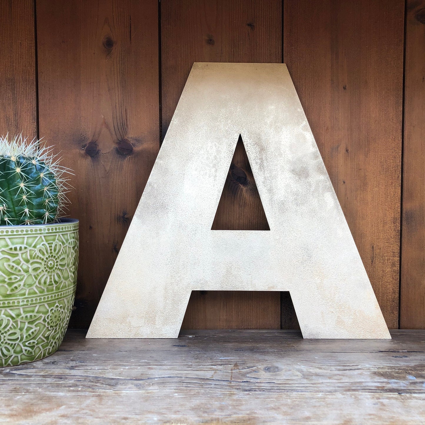Distressed gold metal letter A