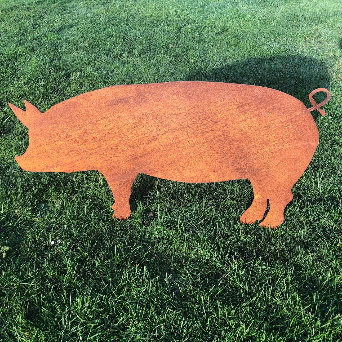 Large rusty metal garden pig decoration