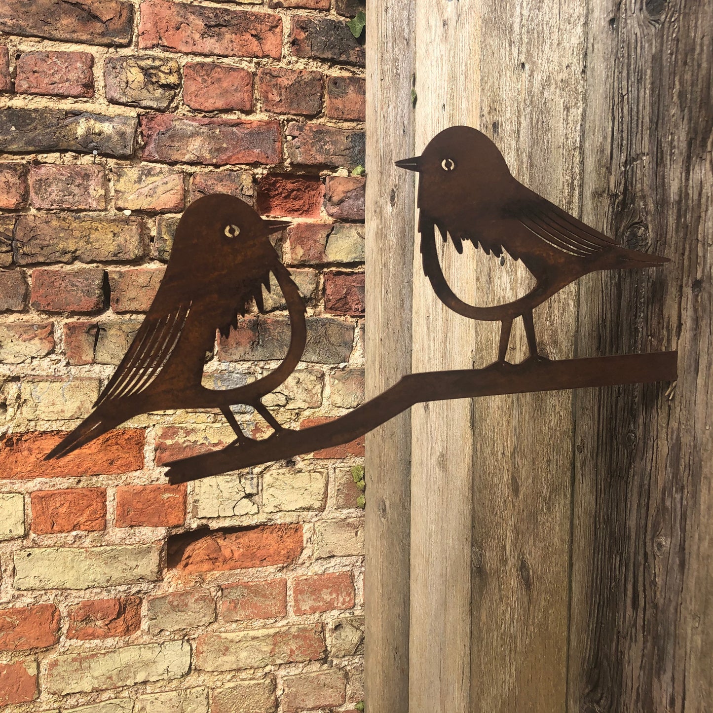 Pair of Robins on a branch garden decoration