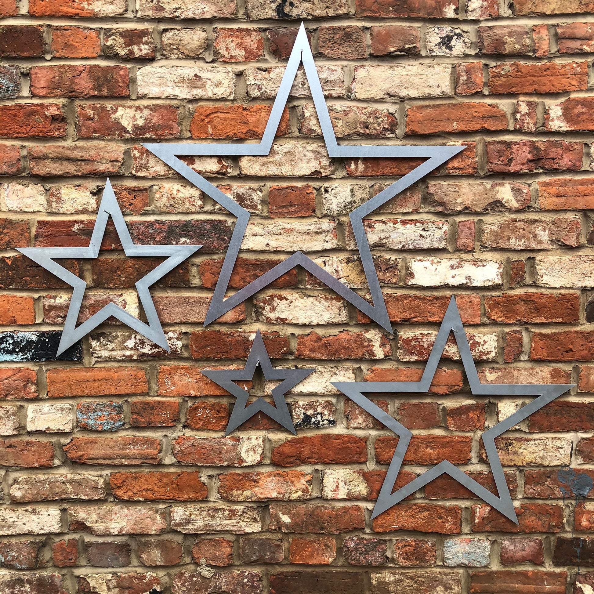 Set of 4 galvanised steel hollow stars wall decoration