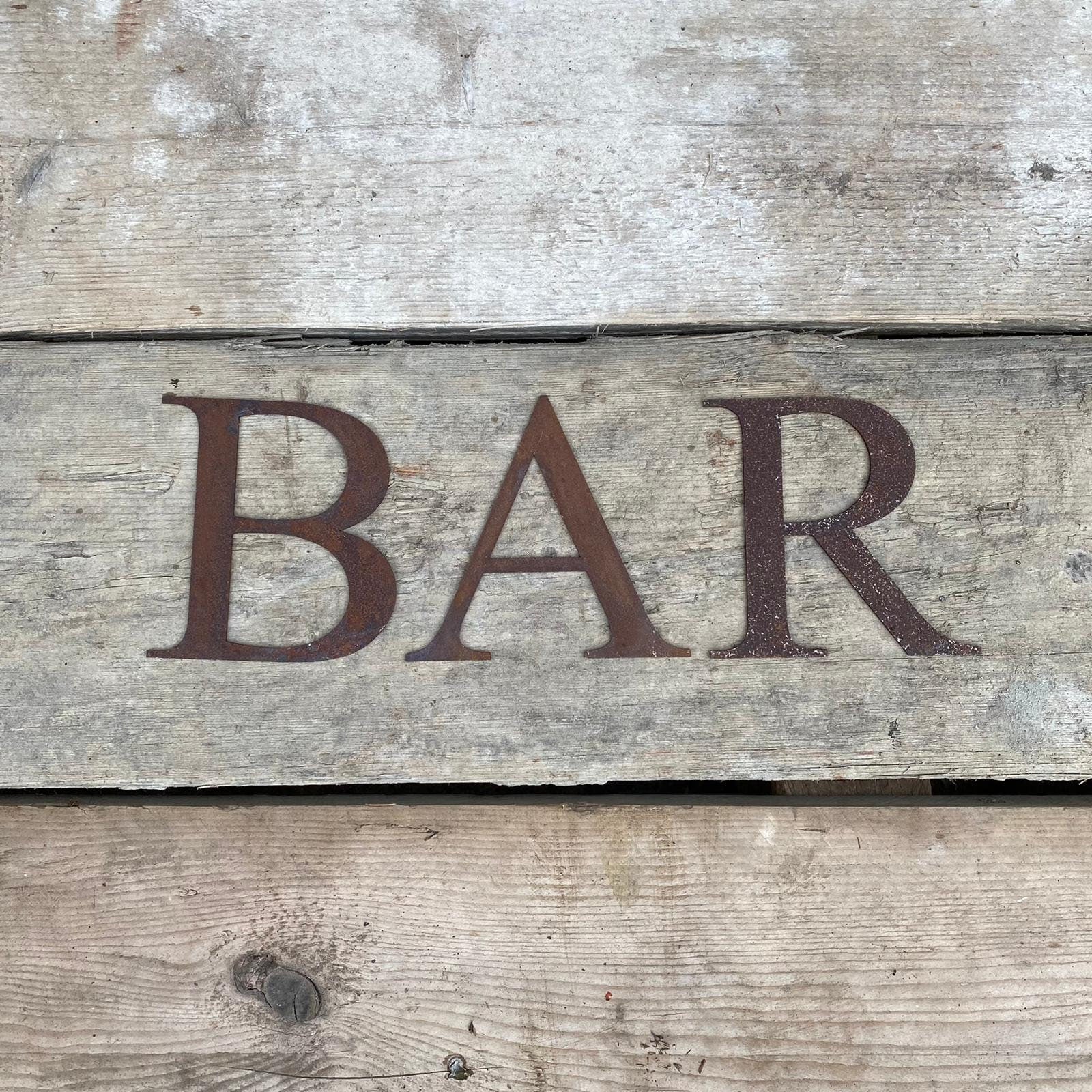 Classic style lettering spelling out BAR