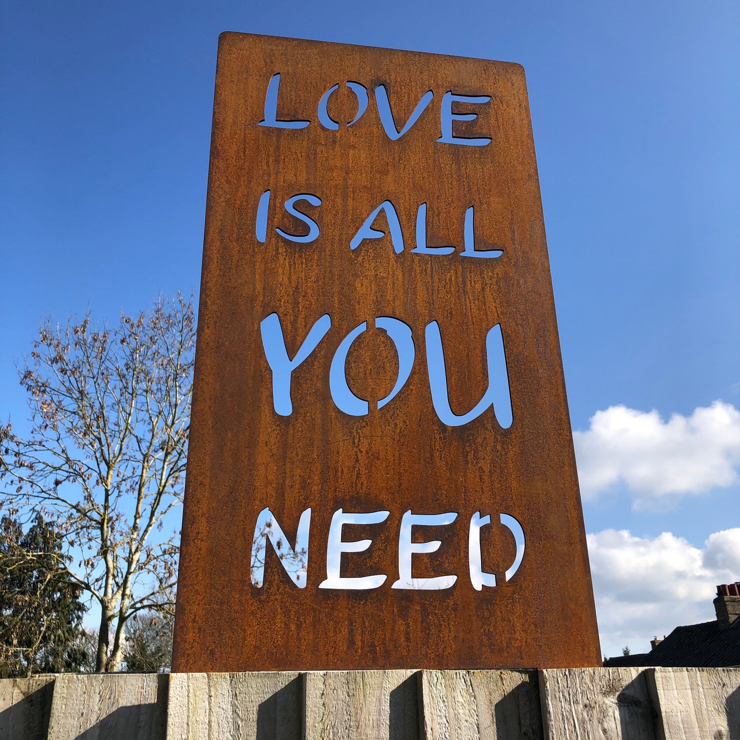 Rusty metal garden sign- love is all you need