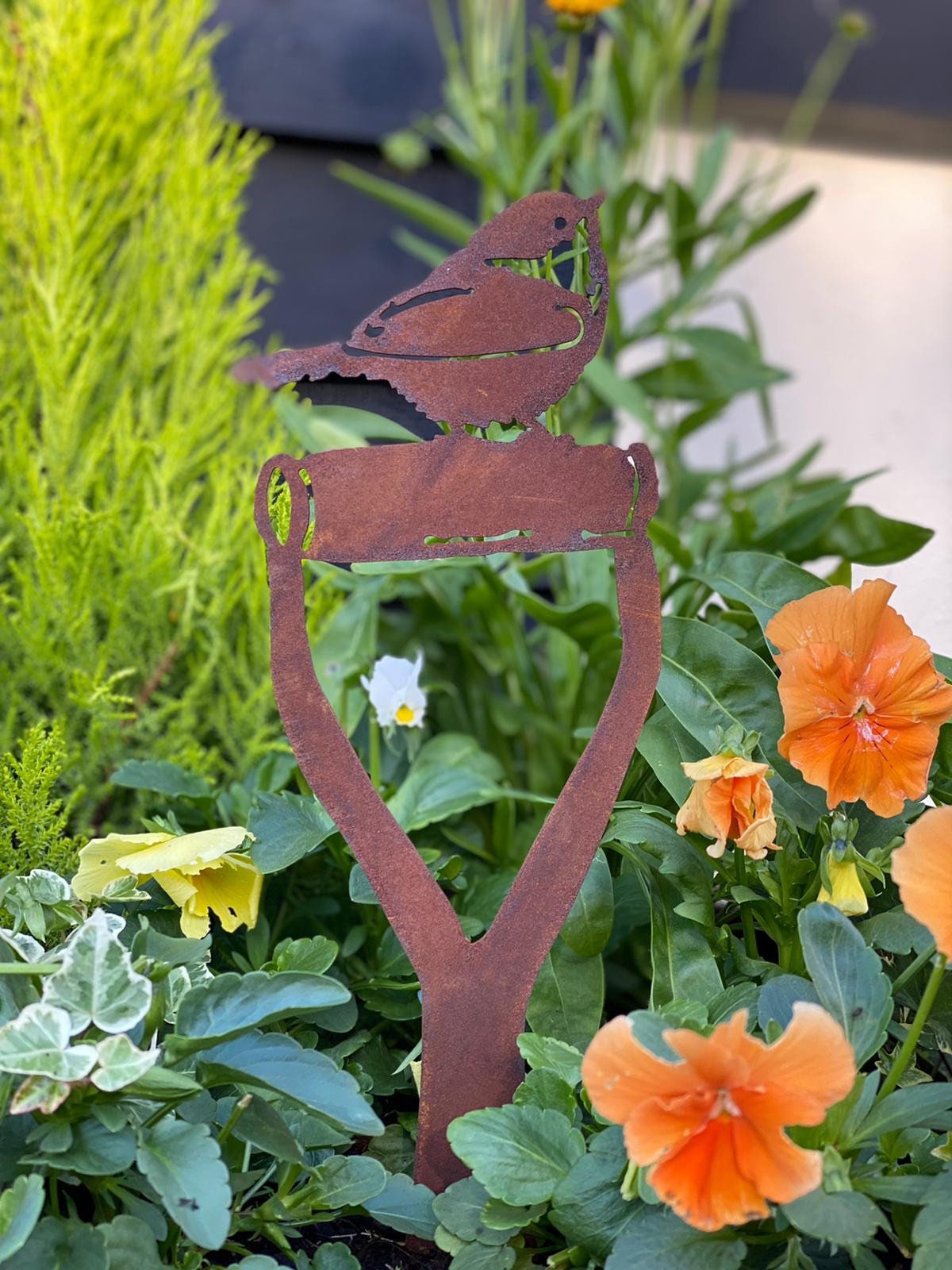 Robin on a spade garden decoration