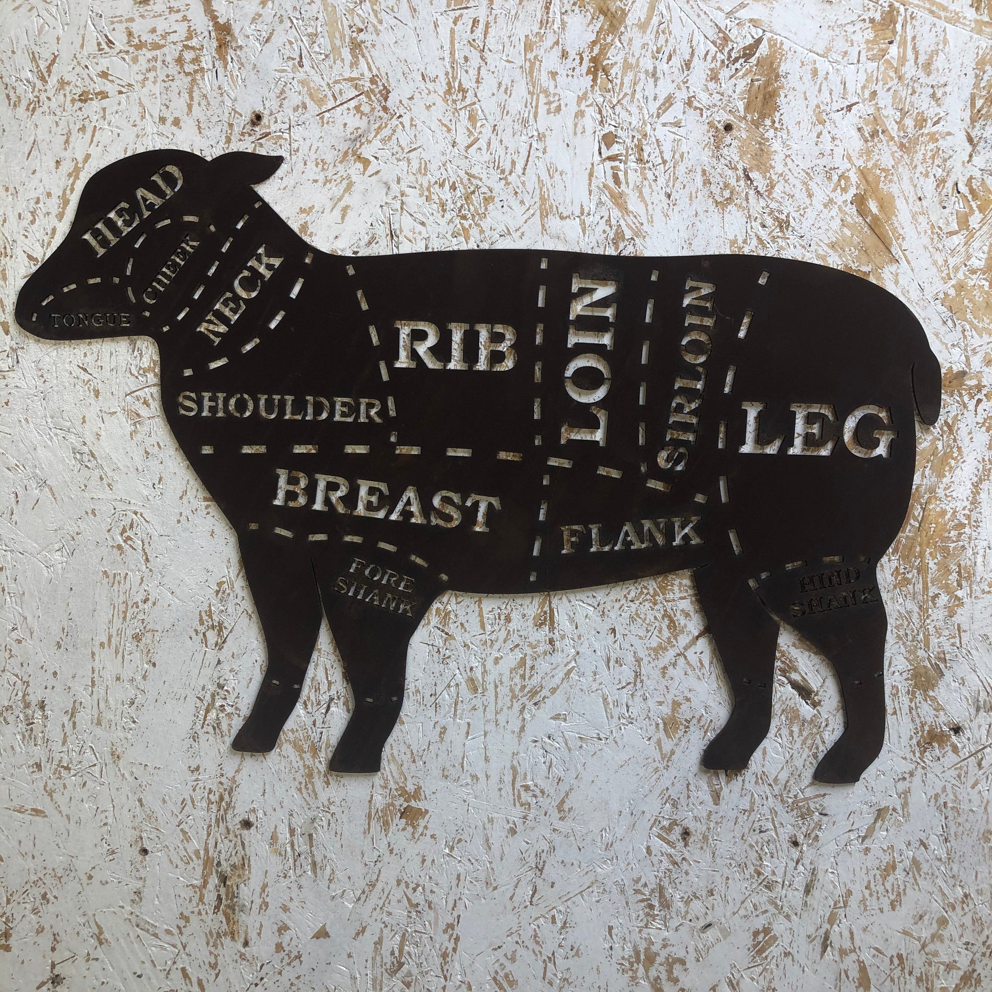 Small rusty metal butchers lamb decoration -  meat cuts design