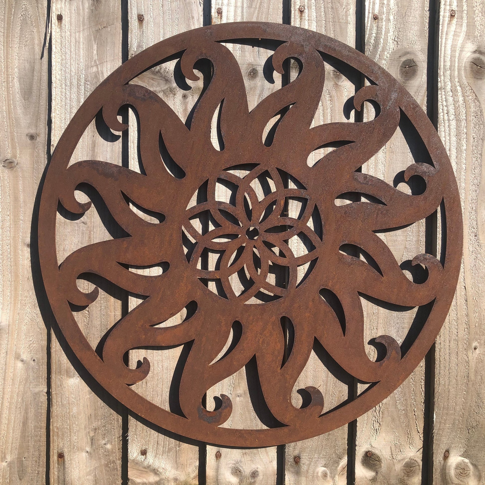 Rusty metal sun wall art decoration